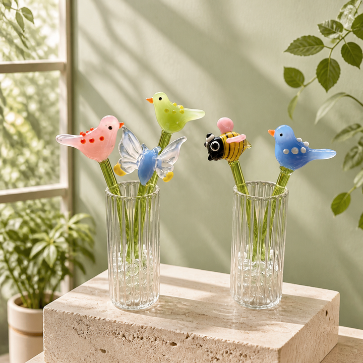 Handmade glass birth flower birds bee and butterfly displayed in ribbed glass vases